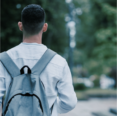 A student facing away, unsure of his future.